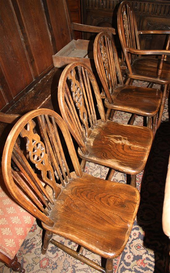 Set of four ash and elm wheelback chairs (one with arms)